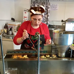 MINI DONUTS MADE FRESH, each is hand turned and takes 3-4 minutes an order. They top them in cinnamon sugar etc. A dozen is $6. A MUST!