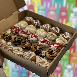 Flavors from left to right: Vanilla drizzle, peanut butter cup, powdered sugar + strawberry jam drizzle, lemon bar, cinnamon roll