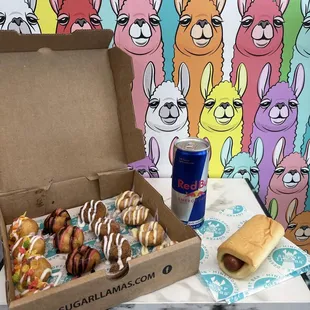 Donuts, sausage Roll, and a Red Bull.