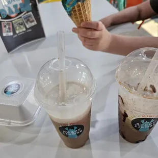 a person holding an ice cream cone