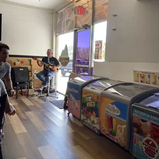 a man playing a guitar