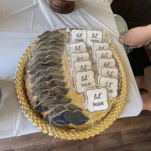 Navy blue "lil' man" and mustache cookies