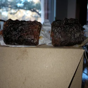 Picture of burnt bars sitting on top of the Sugar Mama's cardboard box.