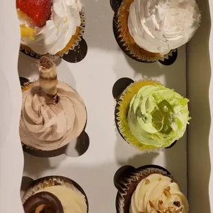 Half a dozen mixed cupcakes.