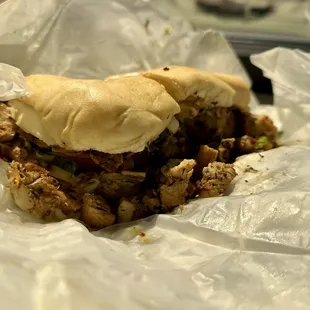 a pulled pork sandwich in a wrapper