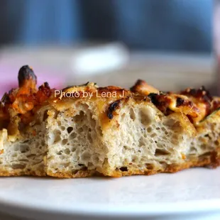 Inside of Focaccia ($5/slice) - harissa cauliflower, caramelized onion, gouda, cheddar, rosemary. Delicious.