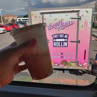 a person holding a cup of coffee