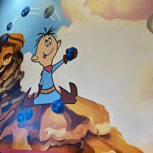  a cartoon character on the wall