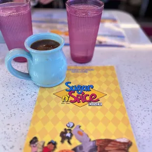  cup of coffee and a menu