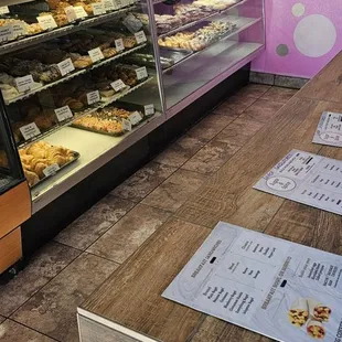 DISPLAY case with Doughnuts, Pastries, and More.