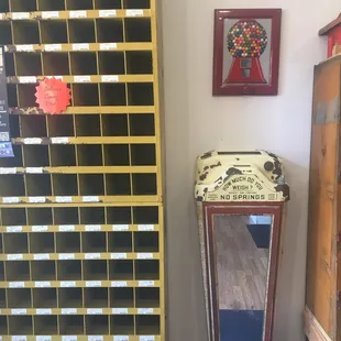 a tall wooden cabinet and a small stool