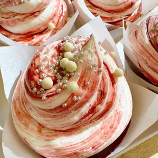 Raspberry Almond Cupcake. White cake filled with raspberry jam and topped with Almond buttercream and raspberry swirl