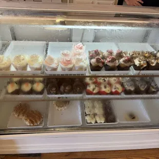 Display case with cupcakes