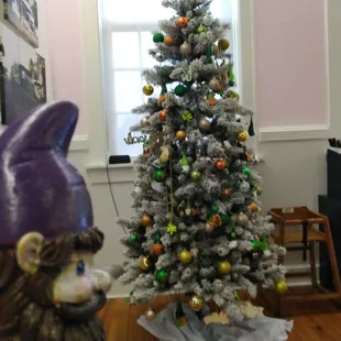 a christmas tree and a gnome figurine