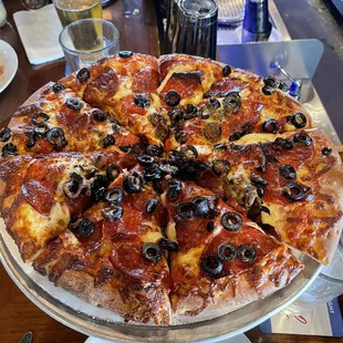 Double pepperoni and black olive pizza.