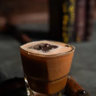 The Death Before Decaf: 
 Fresh brewed espresso, Irish cream, chocolate liqueur, aged dark rum, coffee liqueur, coconut liqueur.