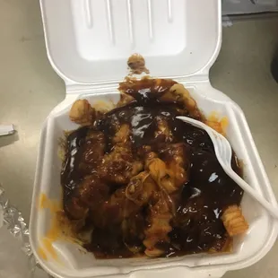 a container of food with a spoon in it