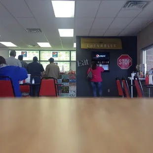 people waiting in line at the counter