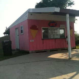 a pink building with ice cream cones on it