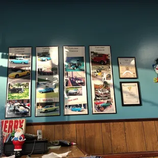 a blue wall with pictures of cars on it