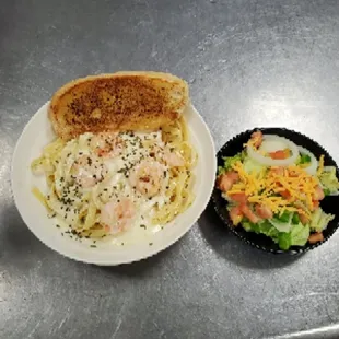 Served Friday evening fish fry: Shrimp Scampi with a side salad and garlic bread