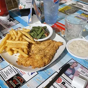 Chicken fried chicken, gravy on side.