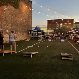 people playing corn hole