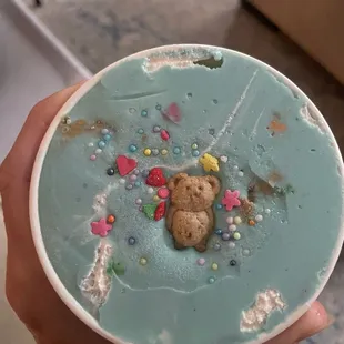 a teddy bear in a bowl of ice cream