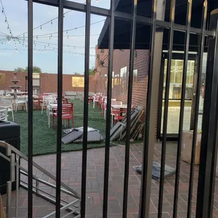 a patio area with tables and chairs