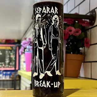 a glass jar with a drink in it