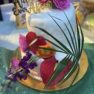 a wedding cake decorated with flowers