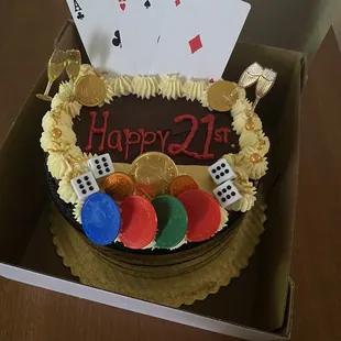a birthday cake with playing cards