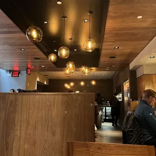 a man sitting at a table in a restaurant