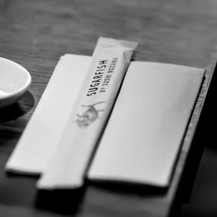 a small bowl and chopsticks on a table