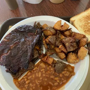 Ribs, burnt ends, beans and fried potatoes