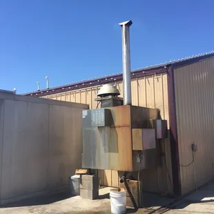 The smoker is out back!