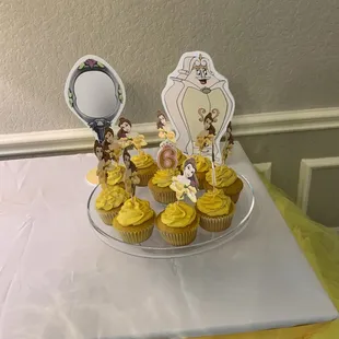 Cupcakes by Sugarfoot&apos;s.  I purchased the belle topper and placed it myself after delivered.