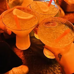 a group of people holding drinks
