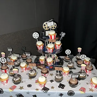 Cupcakes on display at a movie theater birthday party