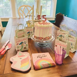 a table with a birthday cake