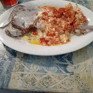 Country fried steak, eggs, and hashbrowns