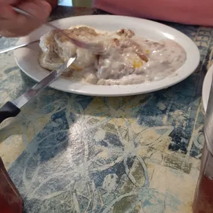 Country fried steak, eggs, and biscuit