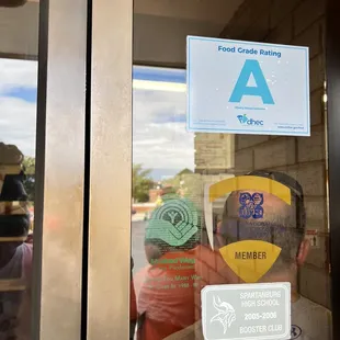 a man looking through a glass door