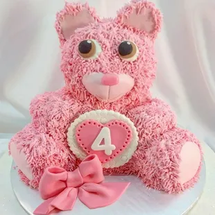 a pink teddy bear cake
