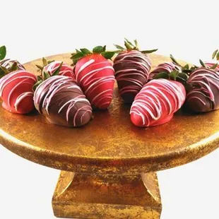 a plate of chocolate covered strawberries