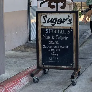 a sign for sugar's crab shack
