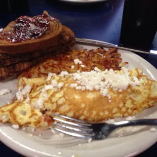 Greek omelette with hash brown and toast.