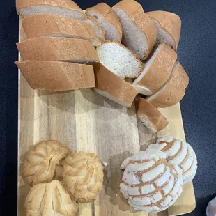 a variety of breads on a cutting board