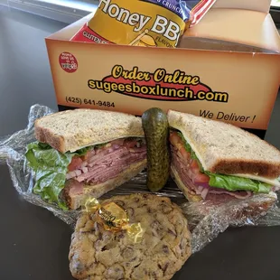 Pastrami Sandwich Lunch Box, includes a pickle, a bag of chips, a chocolate chip cookie and a hard caramel candy...all for $13.00