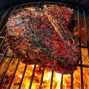 Bone in T bone steak dusted w Cajun flavors meat spices.